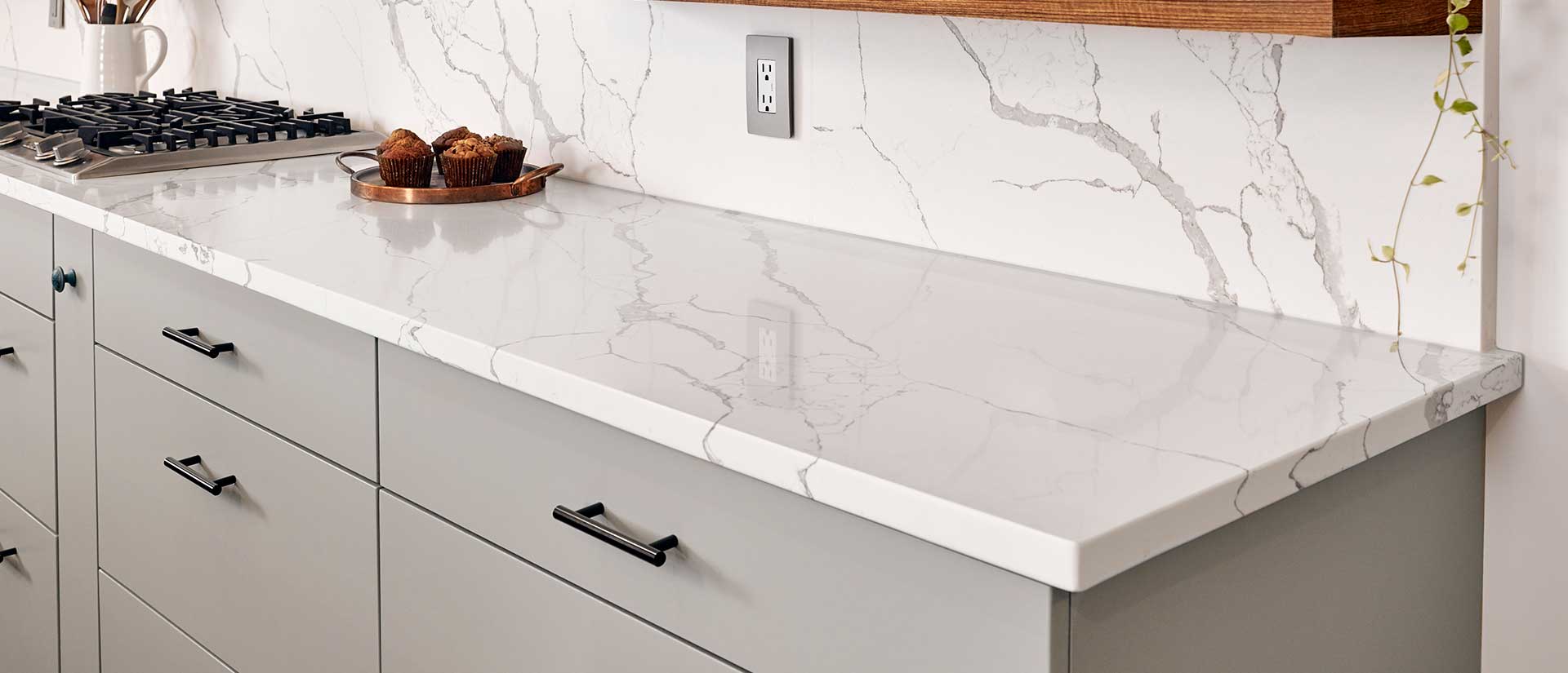 Calacatta Laza quartz countertop with milky white base and warm brown veining in a Columbus kitchen
